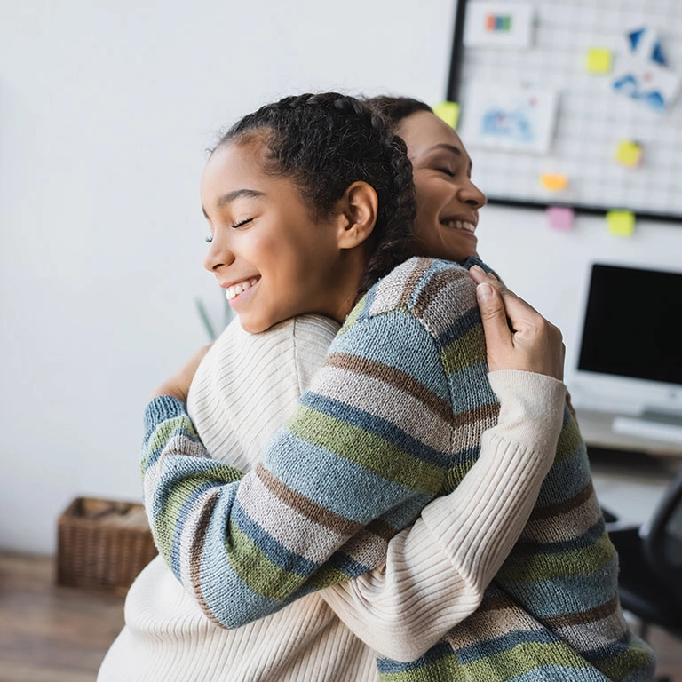 hero-mom-and-teen-daughter-hugging.webp