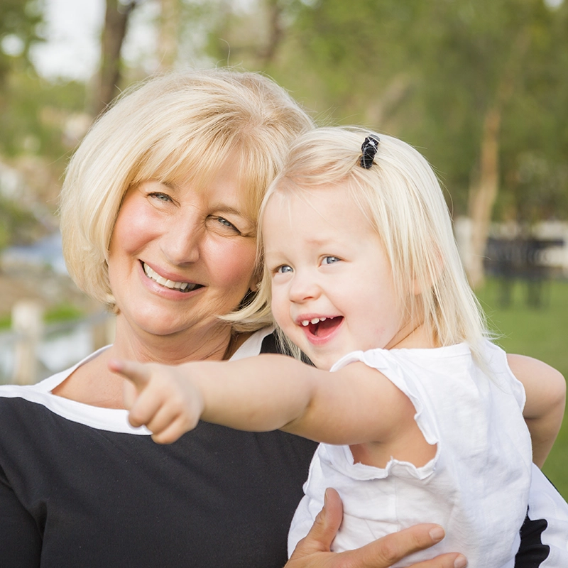 Grandma holding granddaughter 