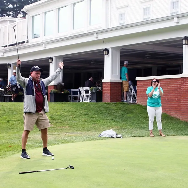 Happy Golfer in Putting Contest