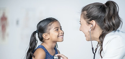 vertab-girl with pigtails and pediatrician.webp