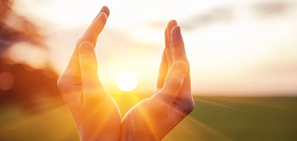 vertab-hands cupping sunshine.webp