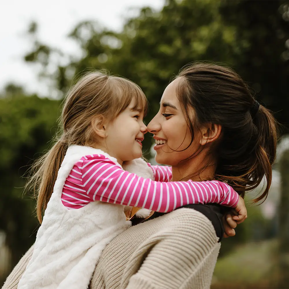 Woman holding child (1000x1000)