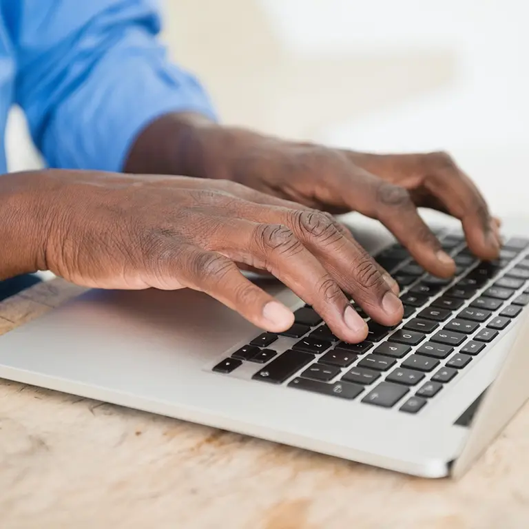 Man typing on keyboard