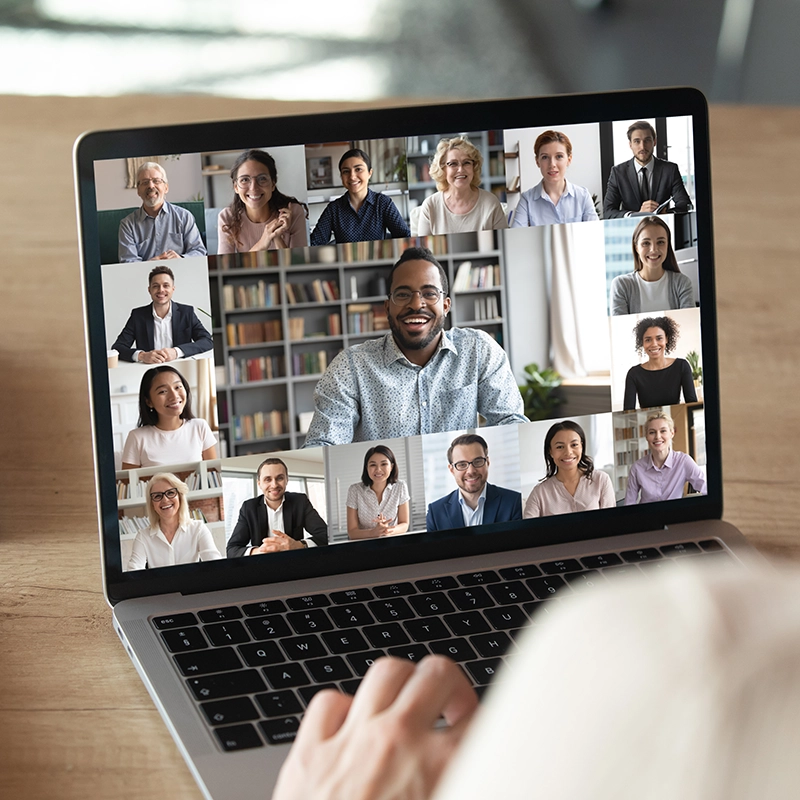 hero-participants in an online meeting laptop.webp