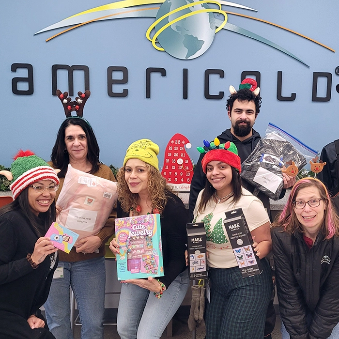 Americold volunteers donating toys