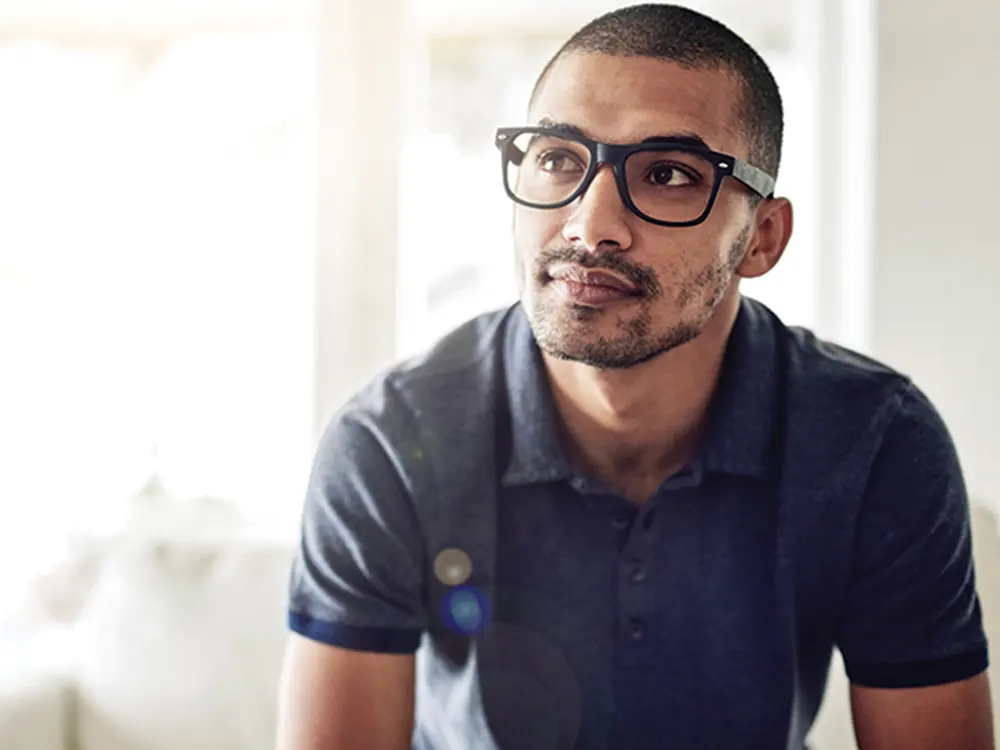 Man with Glasses Looking to the Side (1000x750px news image)