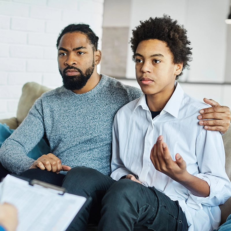 hero-father and son on couch.webp