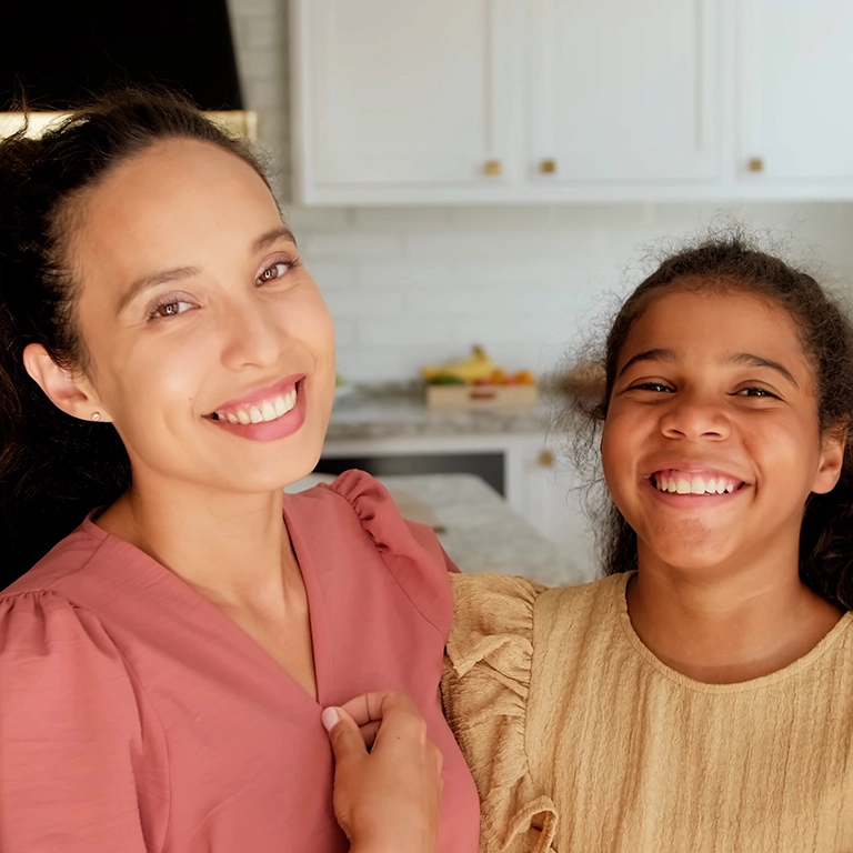 Woman and daughter in kitchen (768x768 accordion image)